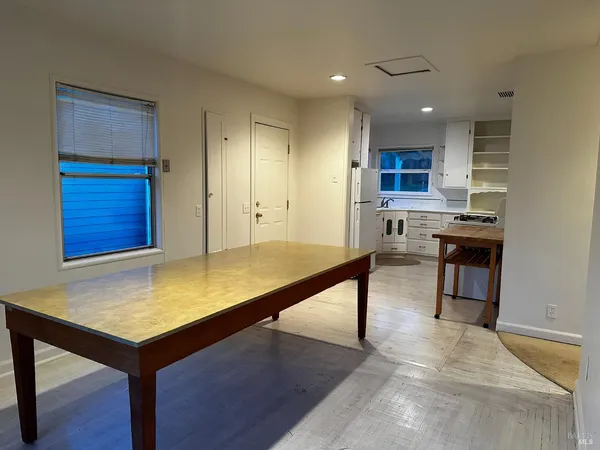 a view of kitchen with kitchen island a sink dishwasher stove and oven