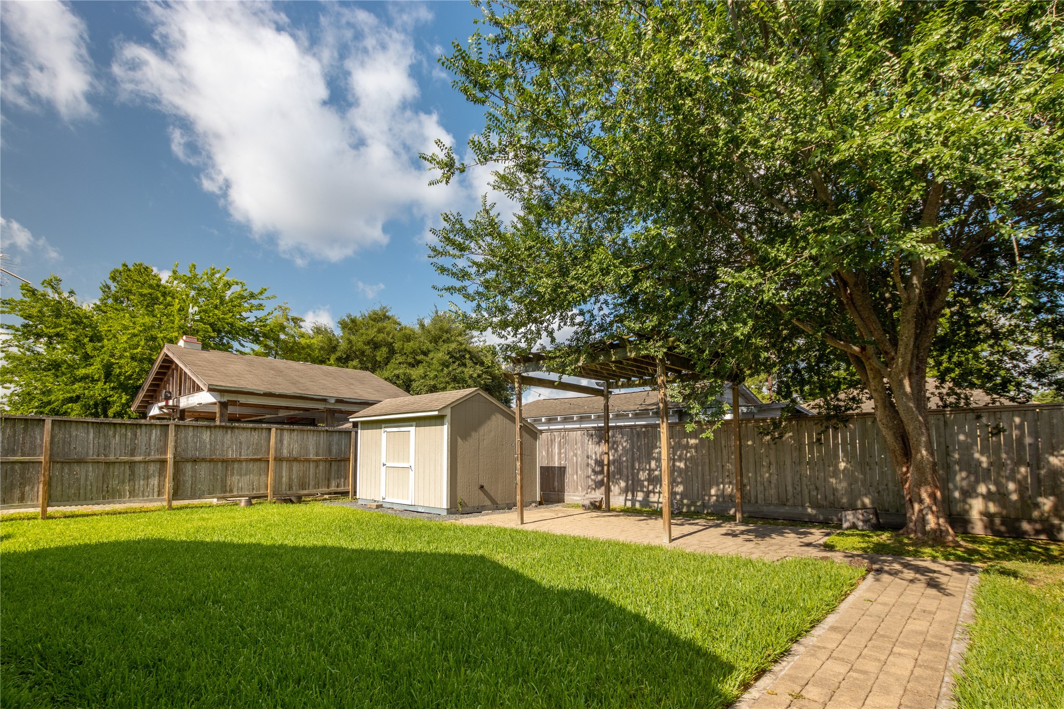 2009 Singleton Street Houston, TX 77008 - Photo 23 of 24 a view of a house with a big yard plants and large trees