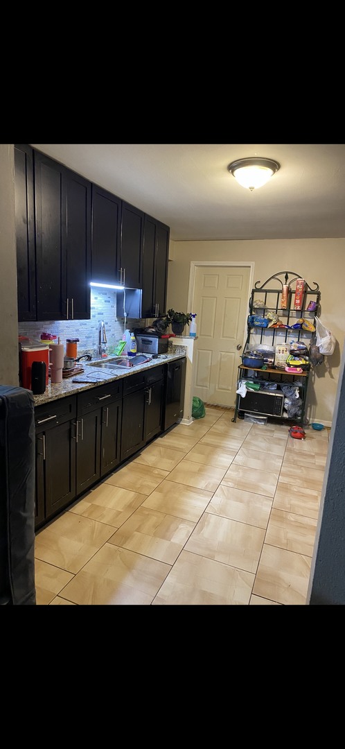 3321 173rd Street Hazel Crest, IL 60429 - Photo 2 of 3 a kitchen with a sink and cabinets