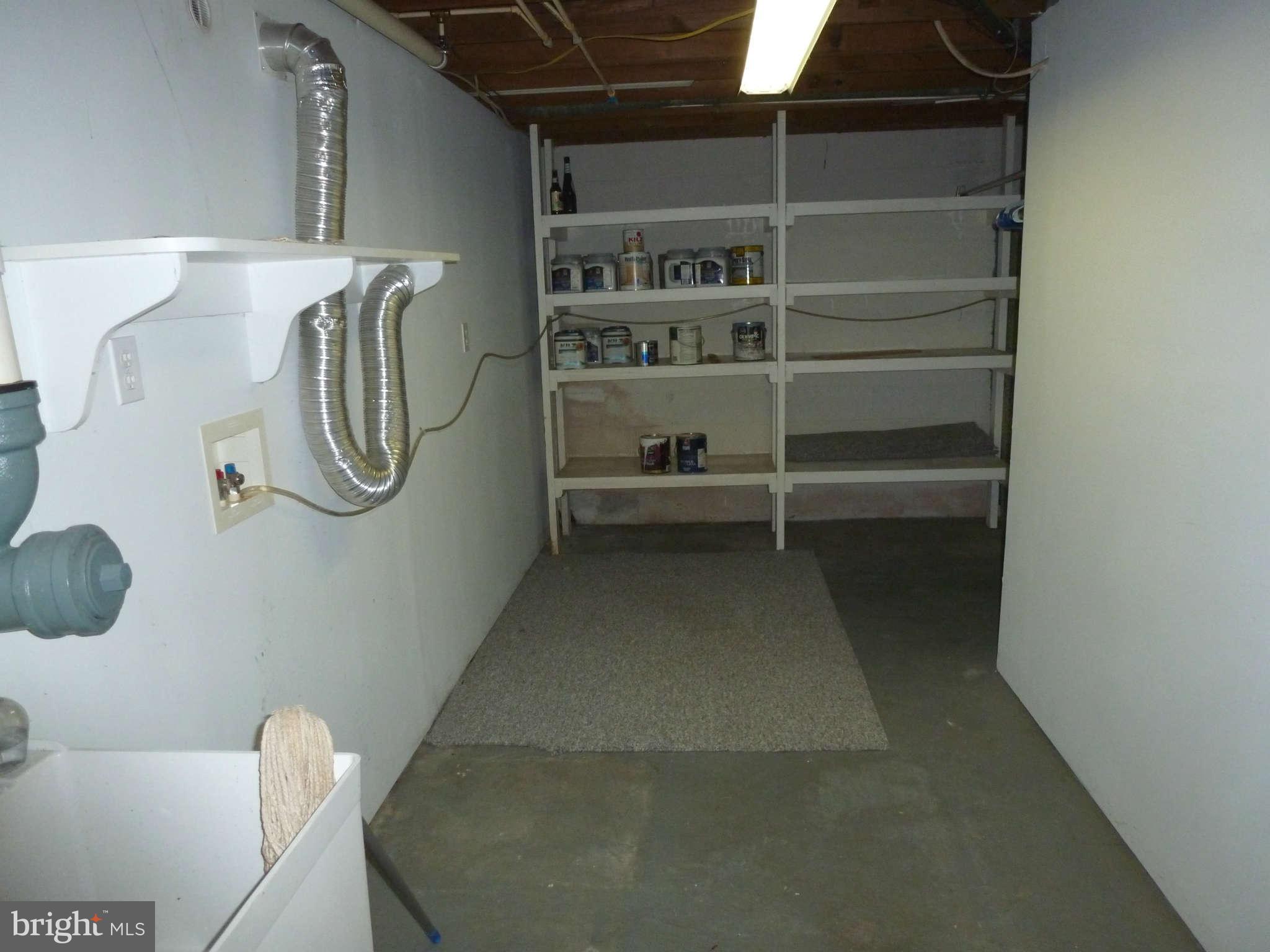 8643 Chestnut Grove Road Frederick, MD 21701 - Photo 17 of 27 Laundry area and built in shelves