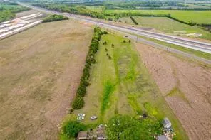 a view of a swimming pool and a yard