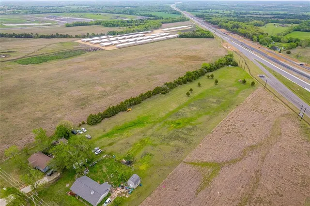 a view of a yard with an outdoor space