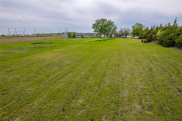 a view of a garden with a house