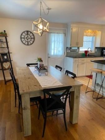 358 Sherburne Road Pelham, NH 03076 - Photo 11 of 35 a view of a dining room with furniture and window