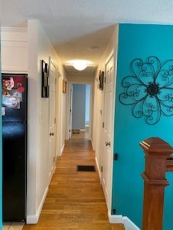 358 Sherburne Road Pelham, NH 03076 - Photo 15 of 35 a view of a hallway with wooden floor