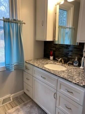 358 Sherburne Road Pelham, NH 03076 - Photo 16 of 35 a bathroom with a granite countertop sink and a mirror