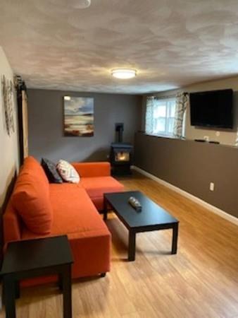 358 Sherburne Road Pelham, NH 03076 - Photo 20 of 35 a bedroom with a bed and a flat screen tv