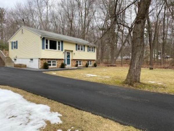 358 Sherburne Road Pelham, NH 03076 - Photo 2 of 35 a view of a house with snow on the background