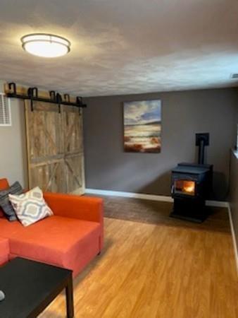 358 Sherburne Road Pelham, NH 03076 - Photo 21 of 35 a bedroom with a bed and a chandelier