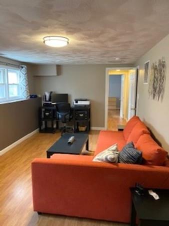 358 Sherburne Road Pelham, NH 03076 - Photo 23 of 35 a living room with furniture and window
