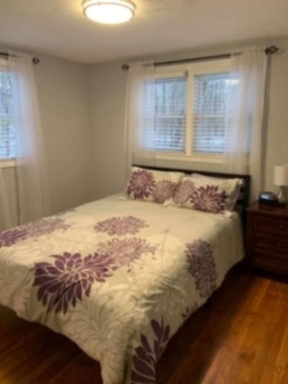 358 Sherburne Road Pelham, NH 03076 - Photo 25 of 35 a bed sitting in a bedroom next to a window