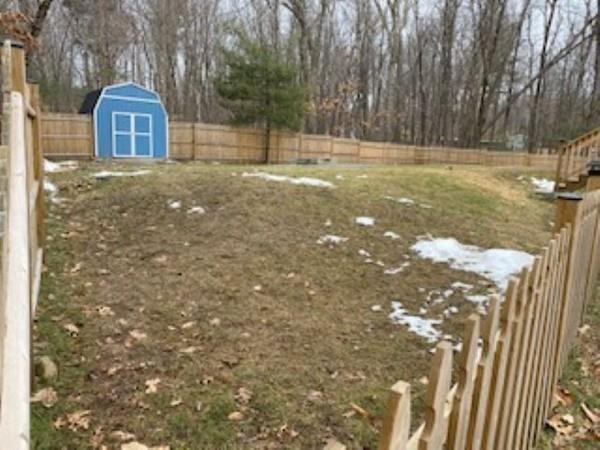 358 Sherburne Road Pelham, NH 03076 - Photo 26 of 35 a view of a yard with a tree
