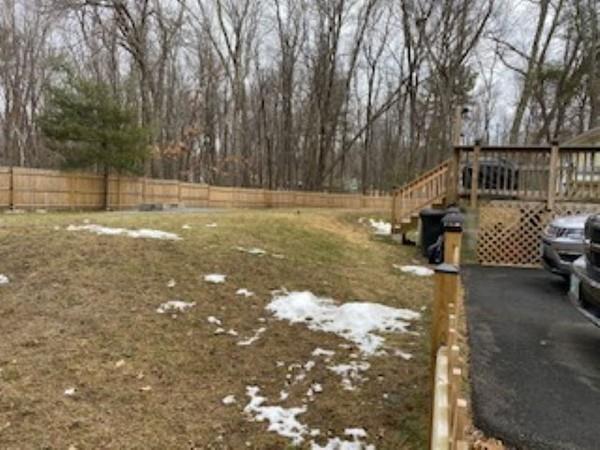 358 Sherburne Road Pelham, NH 03076 - Photo 27 of 35 a view of a yard with wooden fence