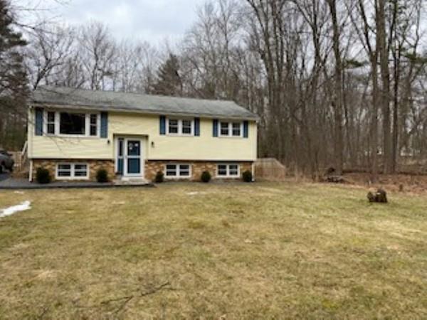 358 Sherburne Road Pelham, NH 03076 - Photo 4 of 35 a front view of a house with a garden and swimming pool