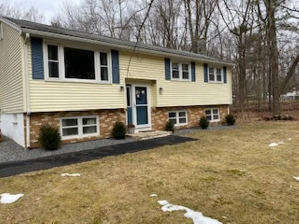 358 Sherburne Road Pelham, NH 03076 - Photo 5 of 35 a view of a house with a yard and garage