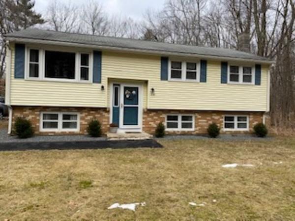 358 Sherburne Road Pelham, NH 03076 - Photo 6 of 35 a house that has a lot of windows and plants