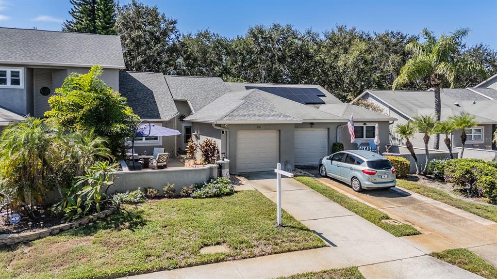 136 Hunter Court Palm Harbor, FL 34684 - Photo 1 of 1 a front view of a house with garden