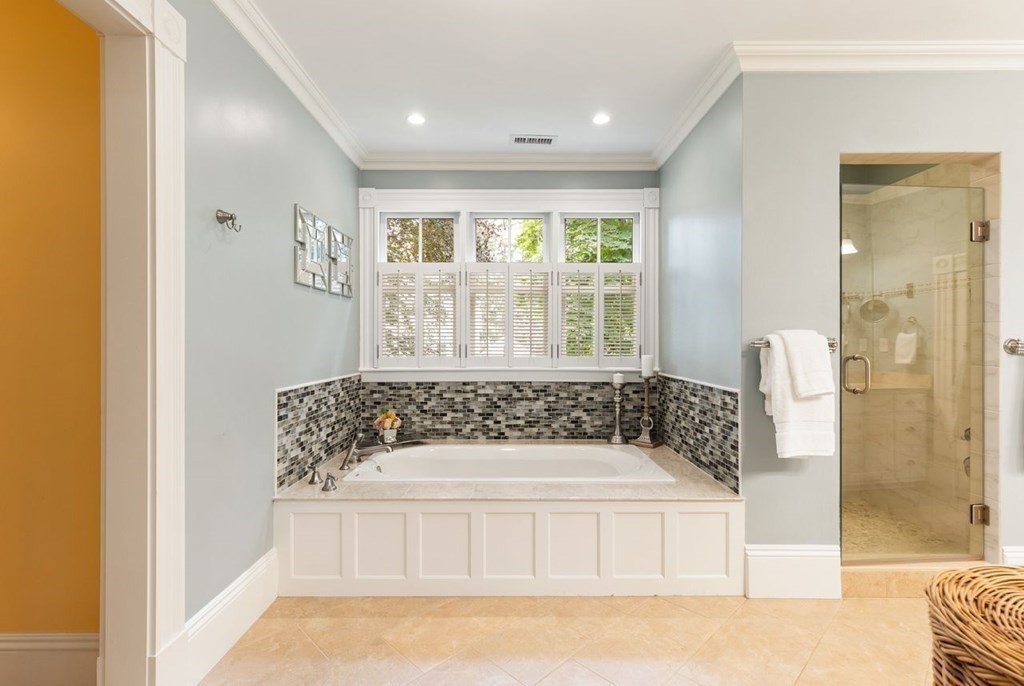 31 Percy Road Lexington, MA 02421 - Photo 18 of 25 a bathroom with a bathtub and a shower