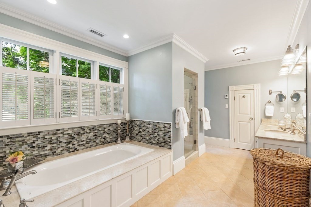 31 Percy Road Lexington, MA 02421 - Photo 19 of 25 a bathroom with a bathtub and a shower