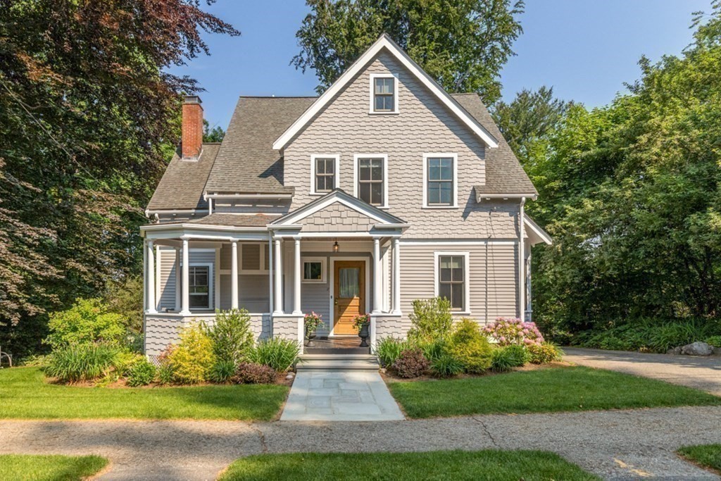 31 Percy Road Lexington, MA 02421 - Photo 25 of 25 a view of a white house next to a yard with big trees