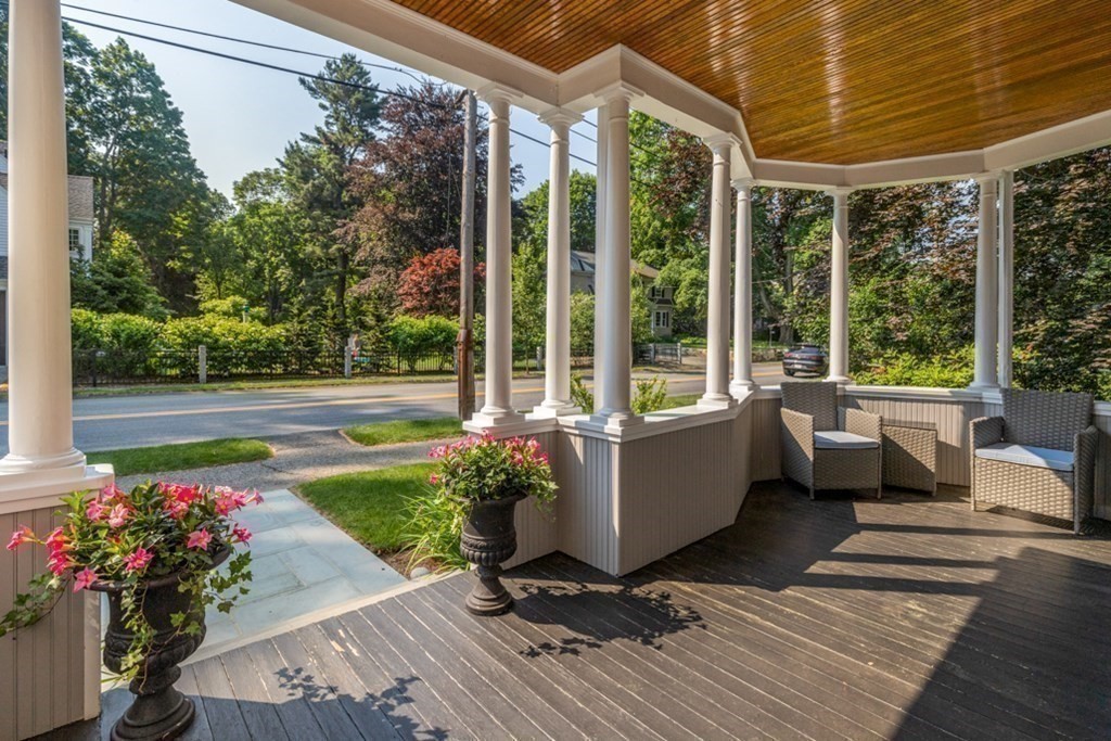 31 Percy Road Lexington, MA 02421 - Photo 5 of 25 a view of a porch with furniture and a yard