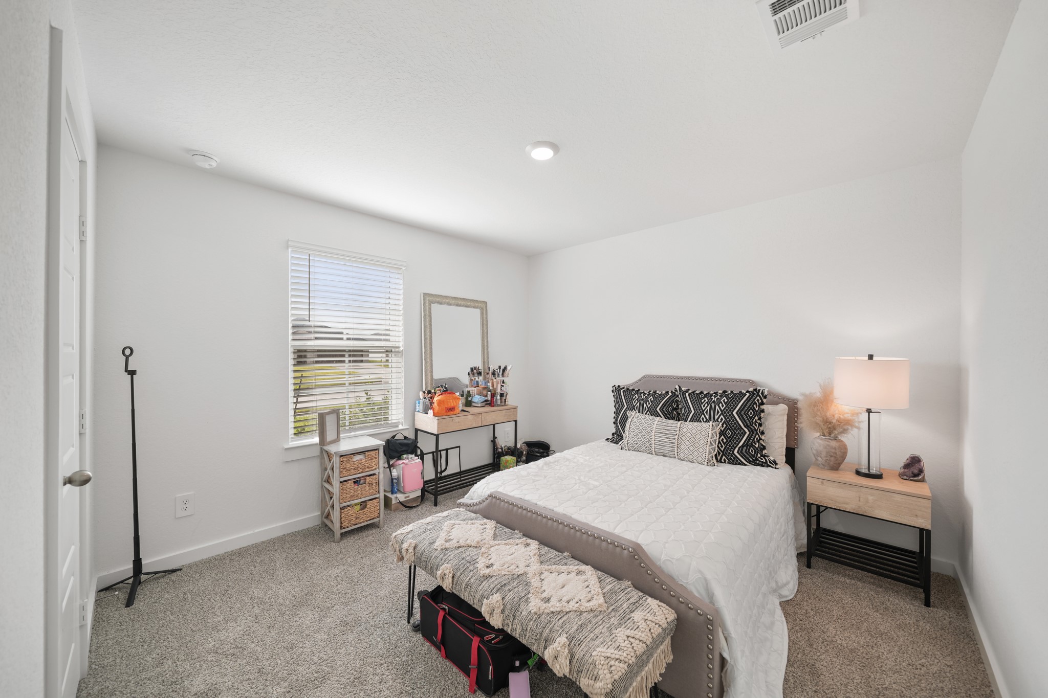 8918 Century Plant Lane Rosharon, TX 77583 - Photo 5 of 19 Spacious bedroom with plush carpeting, recessed lighting, neutral finishes, and a window providing natural light.