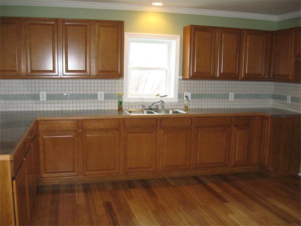 1214 Stafford Road Fall River, MA 02721 - Photo 3 of 14 a bathroom with a sink and cabinets