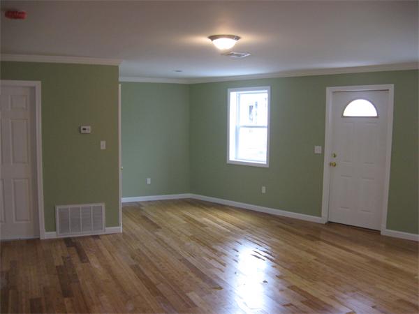 1214 Stafford Road Fall River, MA 02721 - Photo 5 of 14 an empty room with wooden floor and windows