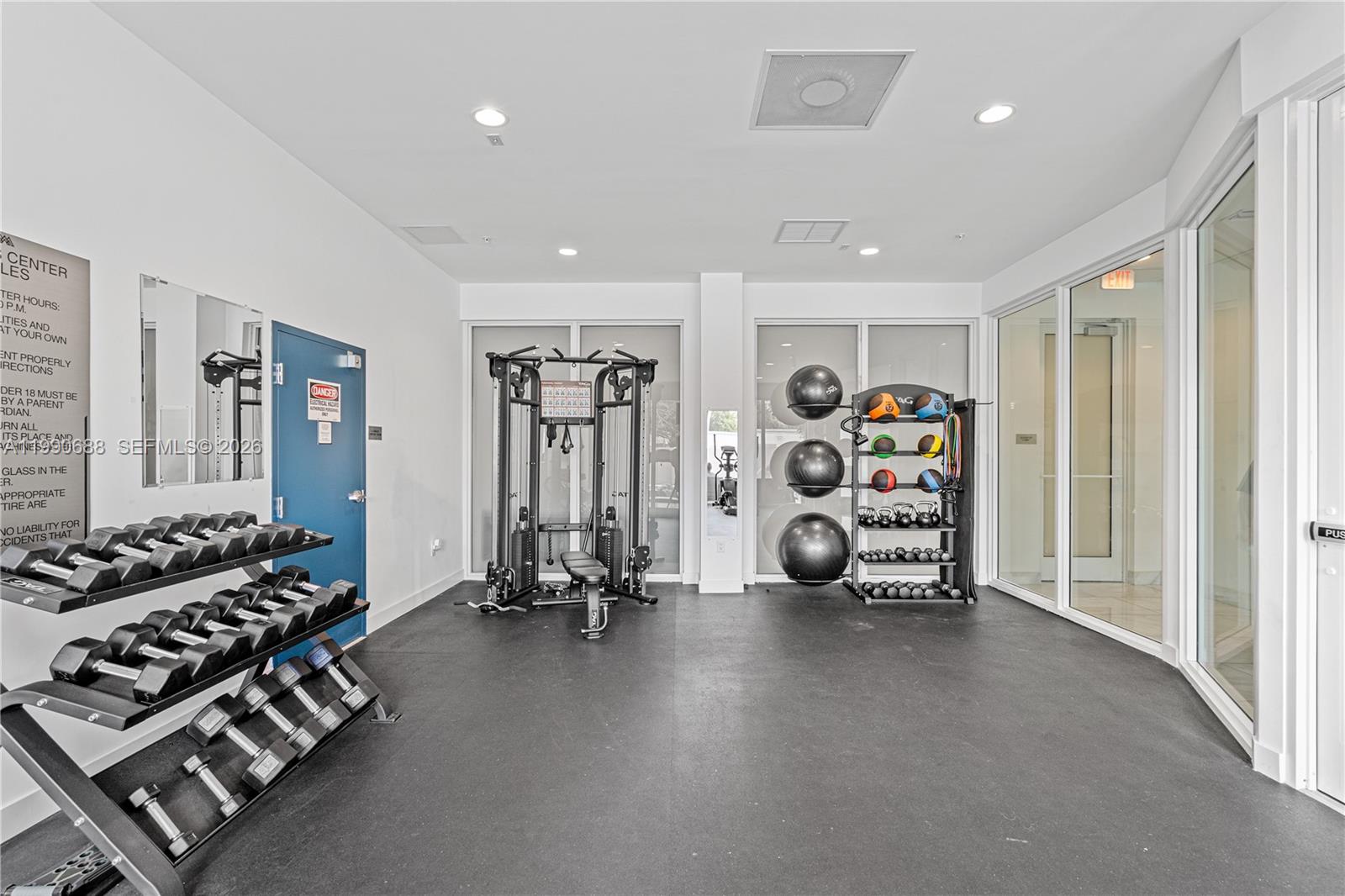 1850 Monroe Street, Unit 308 Hollywood, FL 33020 - Photo 12 of 16 a view of a room with gym equipment