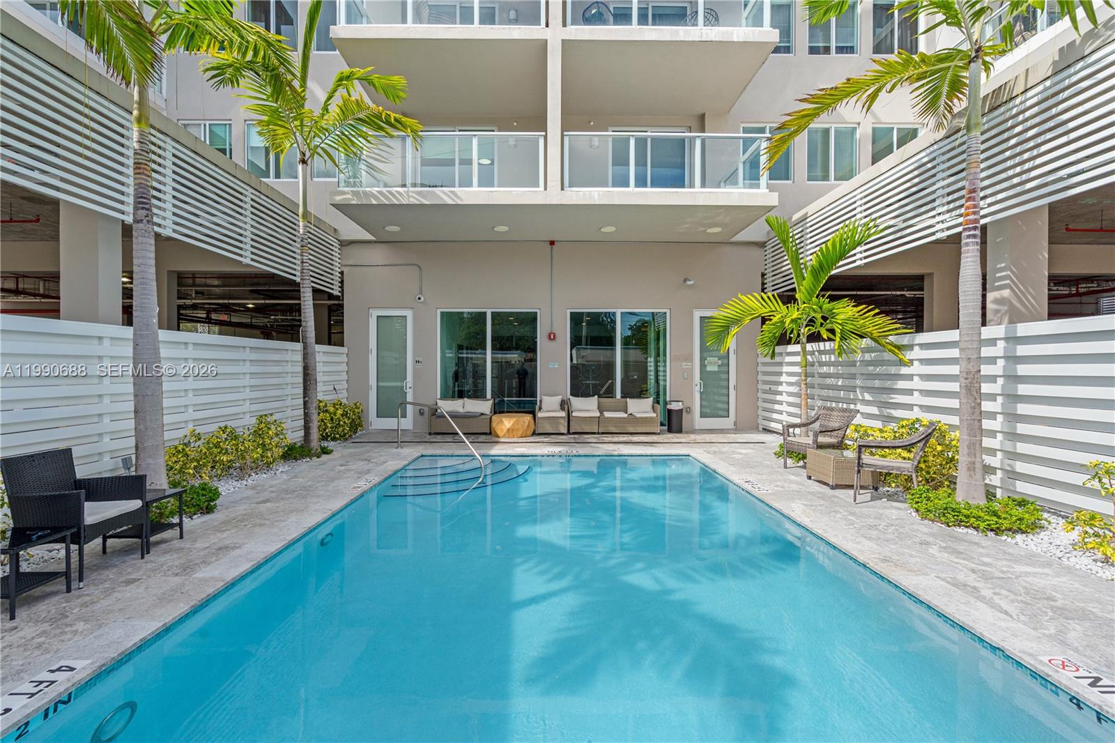 1850 Monroe Street, Unit 308 Hollywood, FL 33020 - Photo 16 of 16 a view of a house with backyard and sitting area