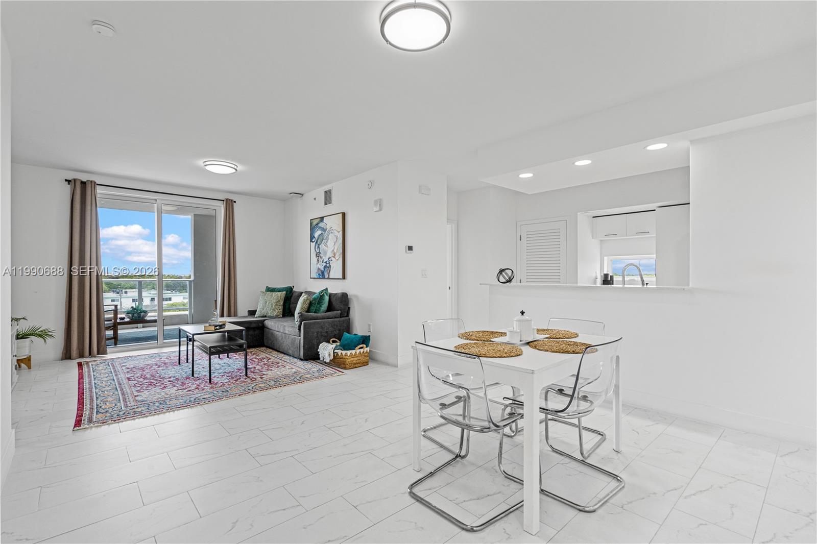 1850 Monroe Street, Unit 308 Hollywood, FL 33020 - Photo 2 of 16 a living room with furniture and wooden floor