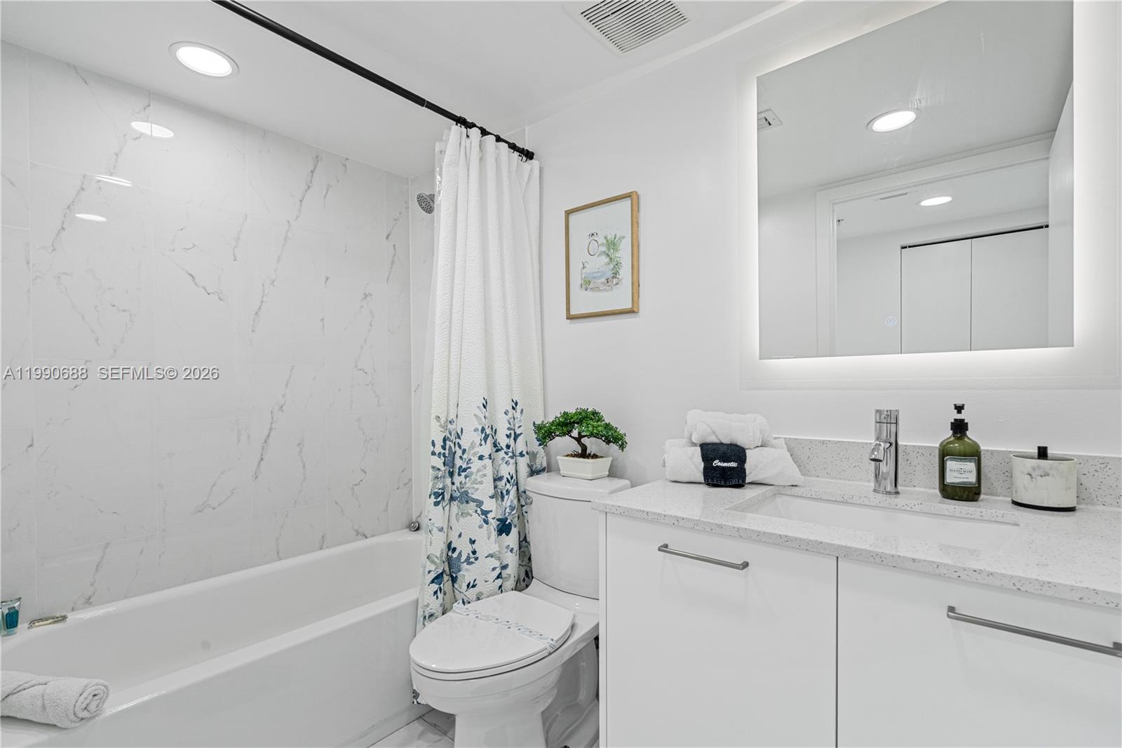 1850 Monroe Street, Unit 308 Hollywood, FL 33020 - Photo 10 of 16 a bathroom with a sink toilet and shower