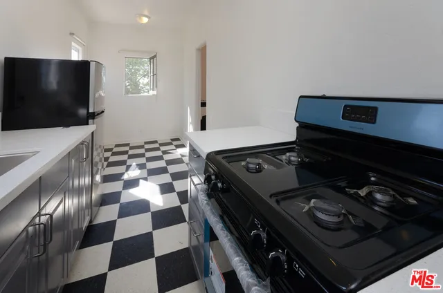 a view of a hallway view with wooden floor and staircase