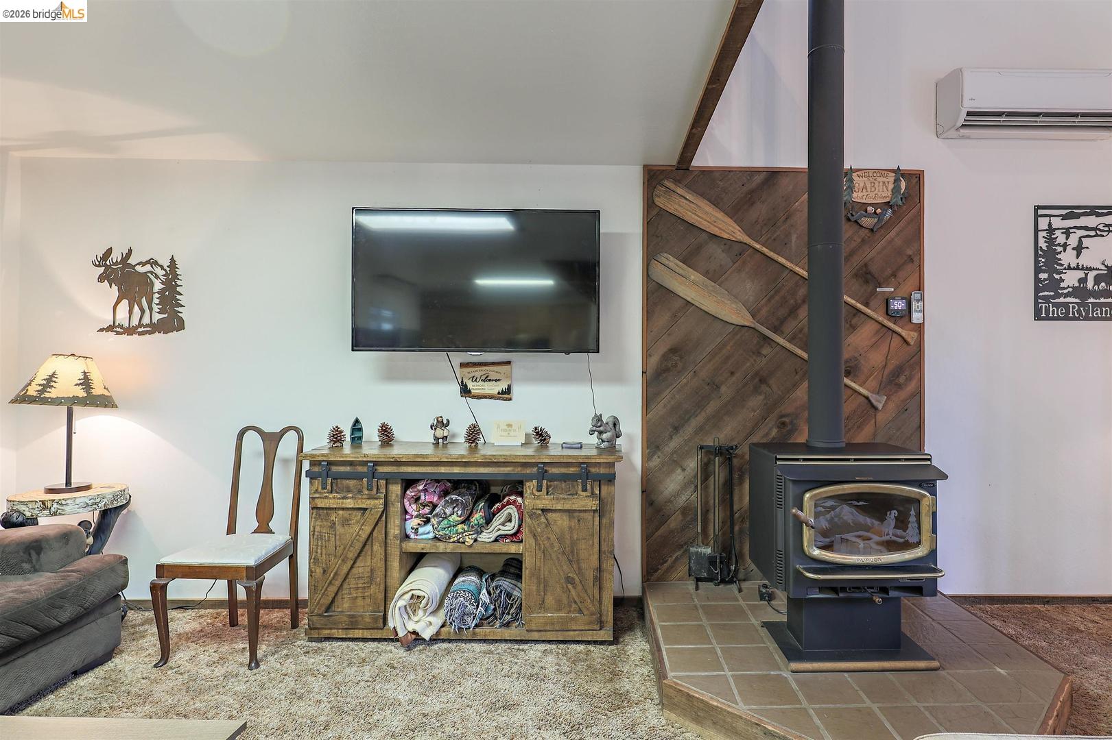 26600 Inyo Drive Cold Springs, CA 95335 - Photo 4 of 38 a living room with furniture and a flat screen tv