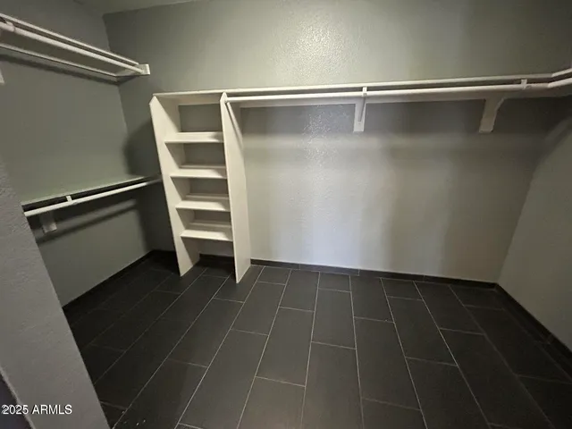 a view of an empty walk in closet