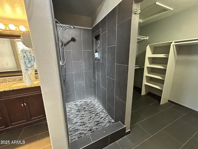 a bathroom with a tub and a shower