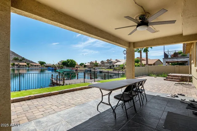 a view of a swimming pool with a patio