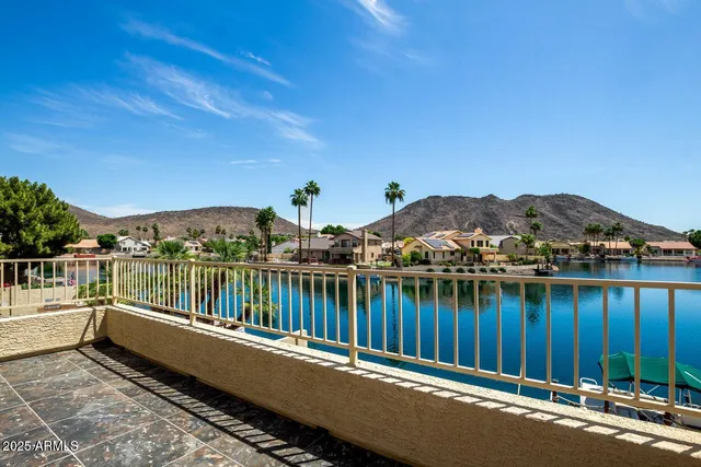 a view of a balcony with chairs