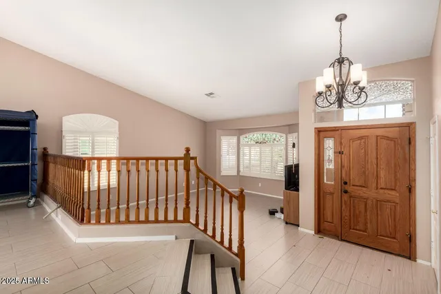 a view of a balcony with furniture and wooden floor