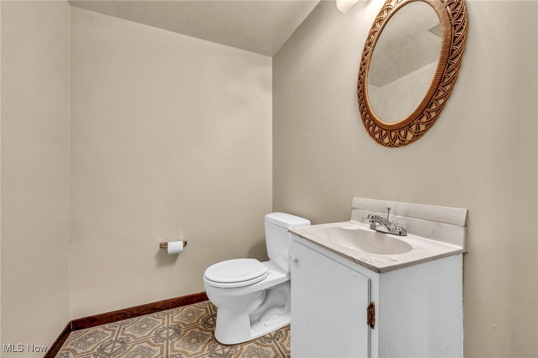 38814 Johnnycake Ridge Road Willoughby, OH 44094 - Photo 39 of 48 Basement Bathroom featuring toilet, vanity