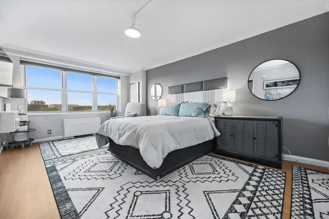 a view of a hallway with closet and a fireplace