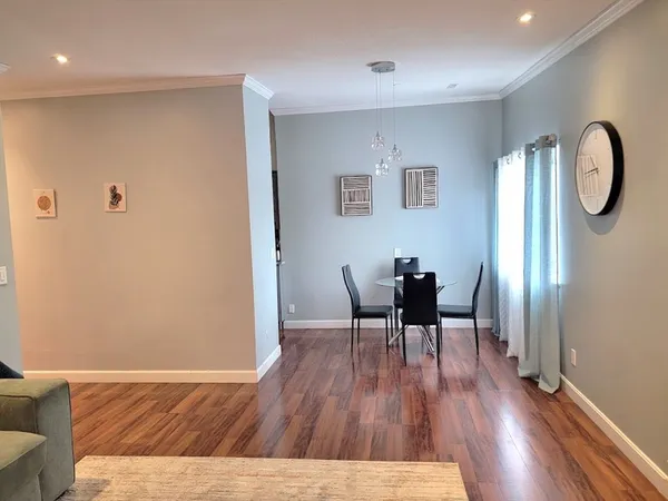 a view of dining room with furniture and wooden floor