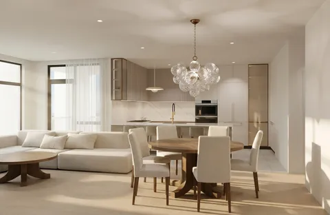 a view of a dining room with furniture and chandelier