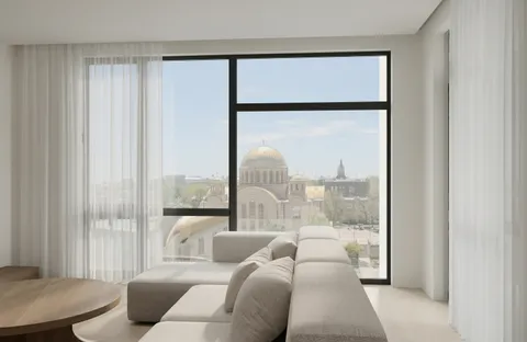a living room with furniture and a large window