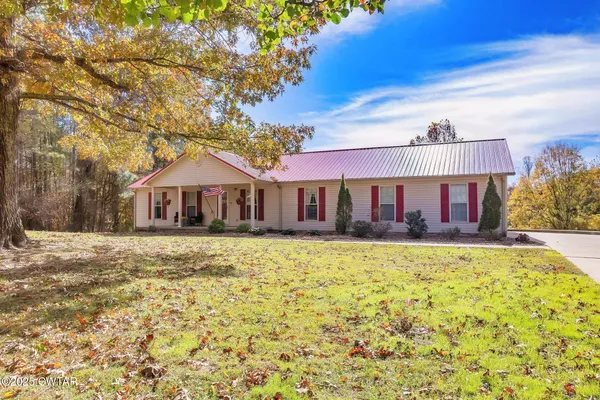 a front view of a house with yard patio and balcony