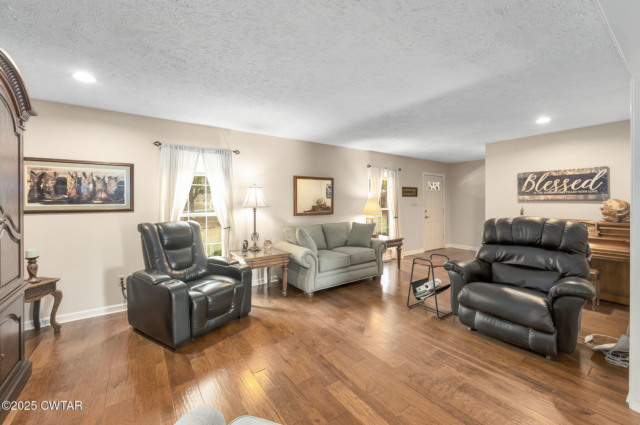 715 Pine Ridge Road Lexington, TN 38351 - Photo 12 of 49 a living room with furniture mirror and a wooden floor