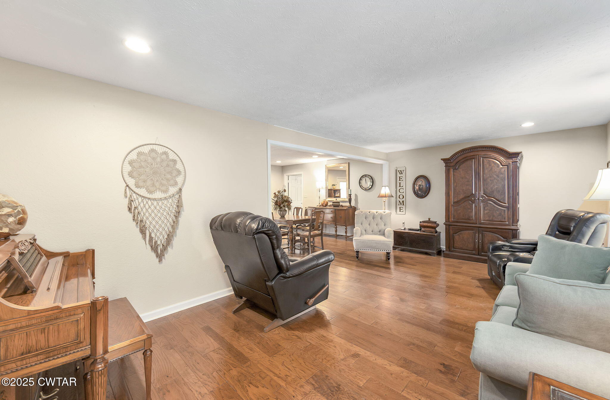 715 Pine Ridge Road Lexington, TN 38351 - Photo 15 of 49 a living room with furniture a rug a lamp and a fireplace