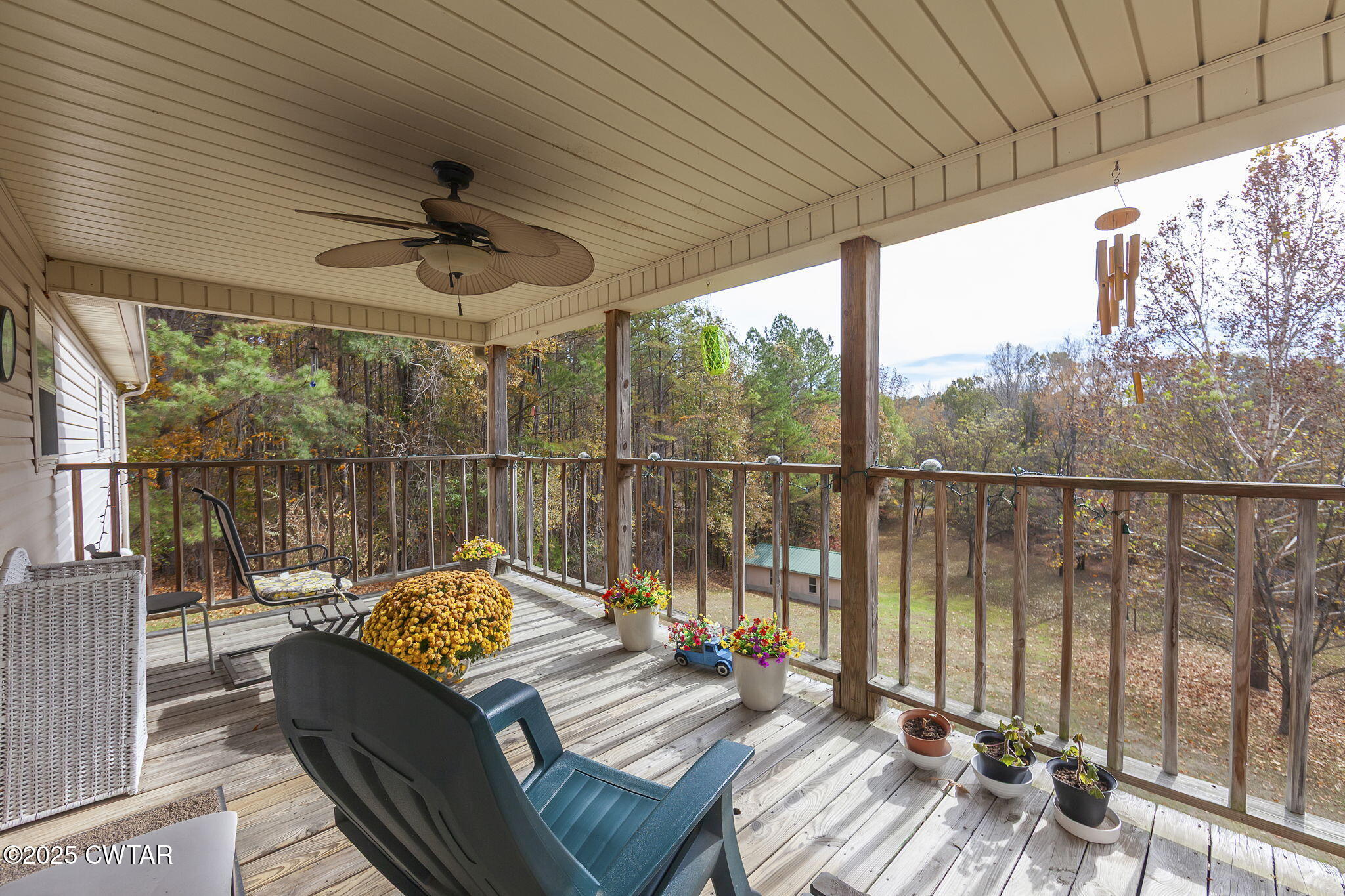 715 Pine Ridge Road Lexington, TN 38351 - Photo 27 of 49 a balcony with furniture and a potted plant