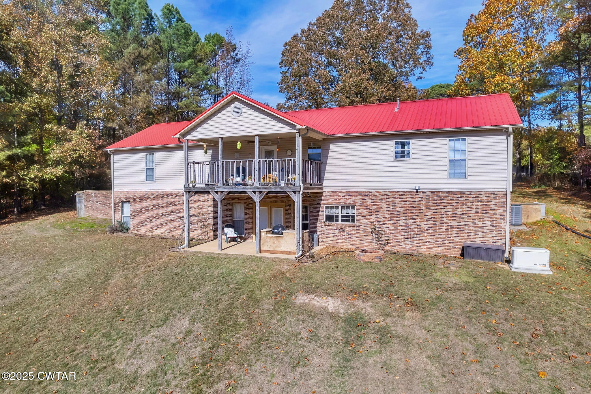 715 Pine Ridge Road Lexington, TN 38351 - Photo 32 of 49 a front view of a house with a yard and garage