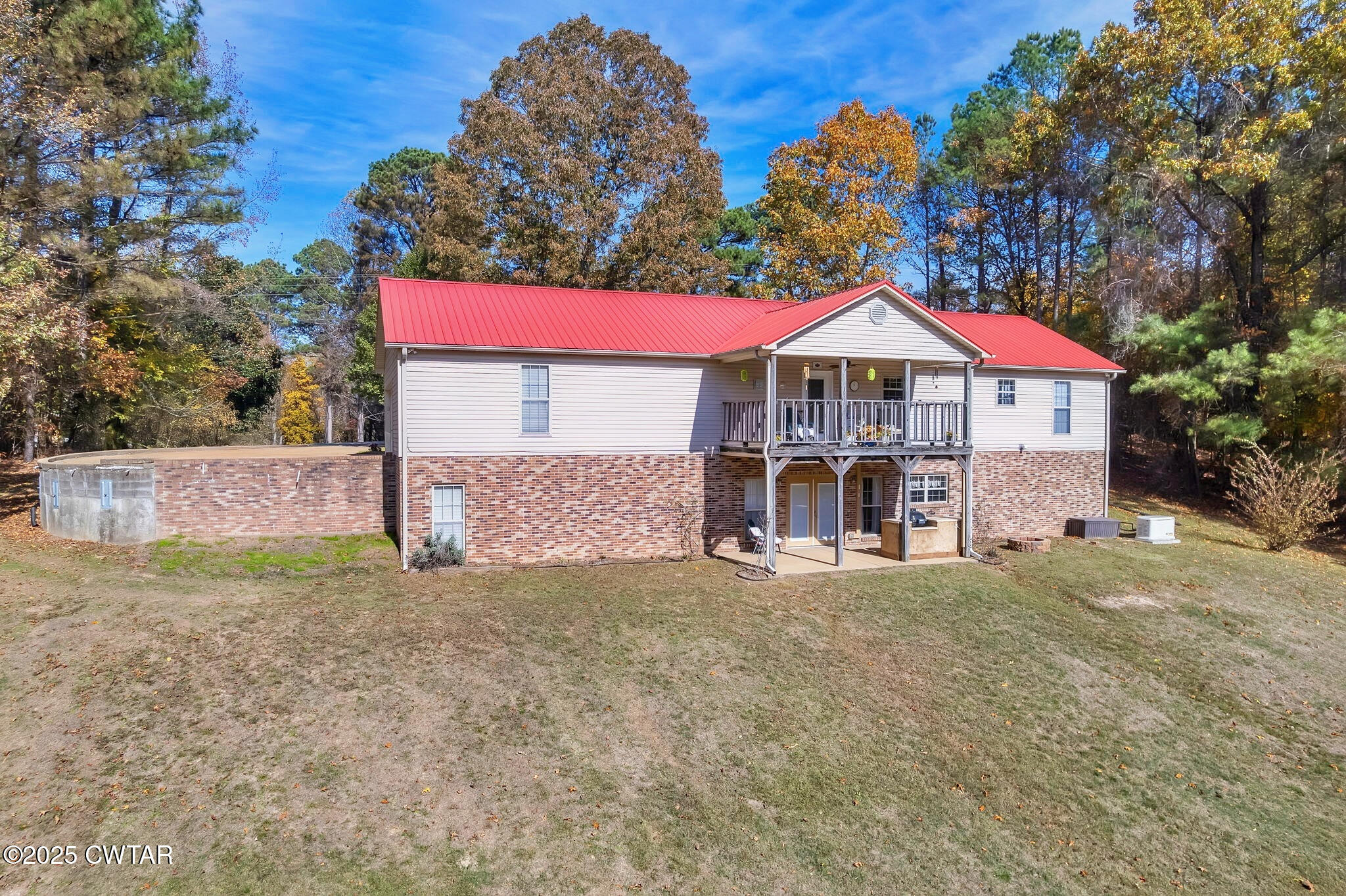 715 Pine Ridge Road Lexington, TN 38351 - Photo 34 of 49 a view of a house with a yard and large tree